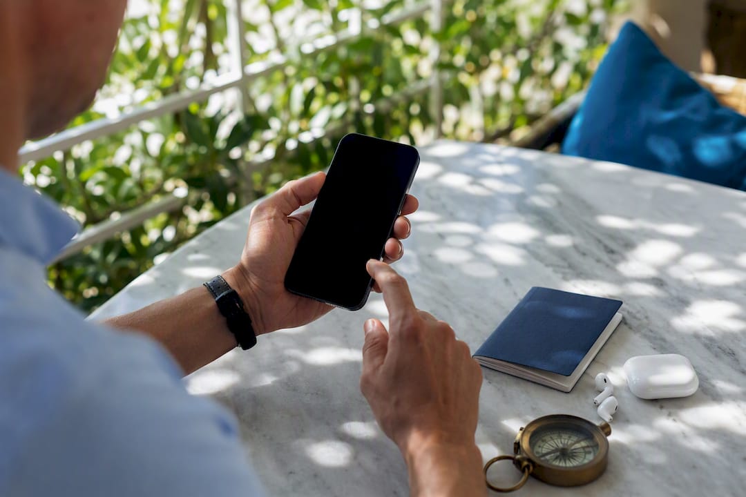 Hands adjusting phone cellular settings