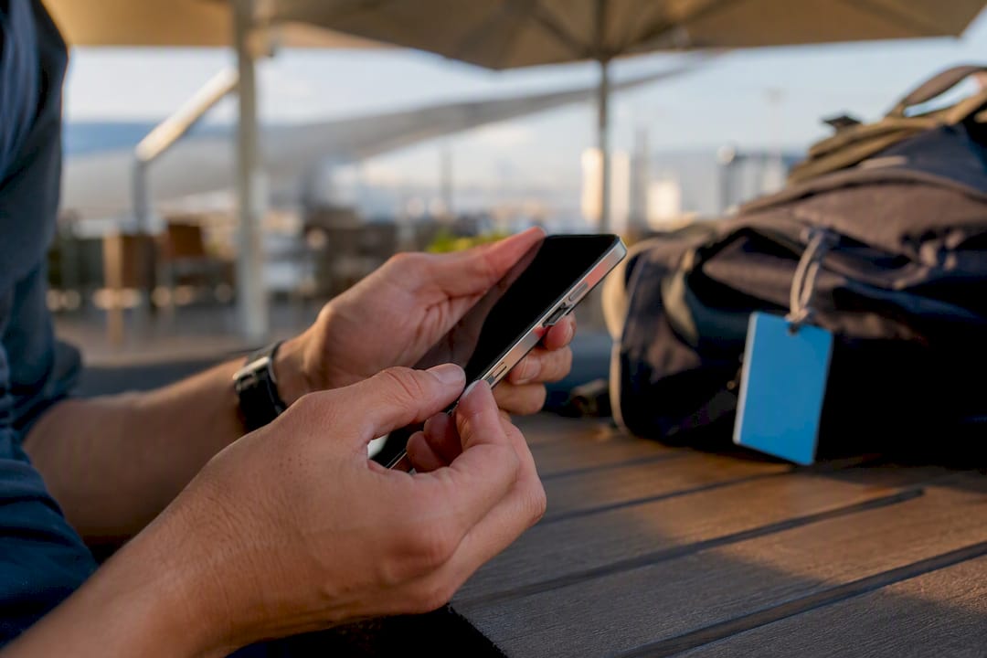 Hands activating eSIM on smartphone