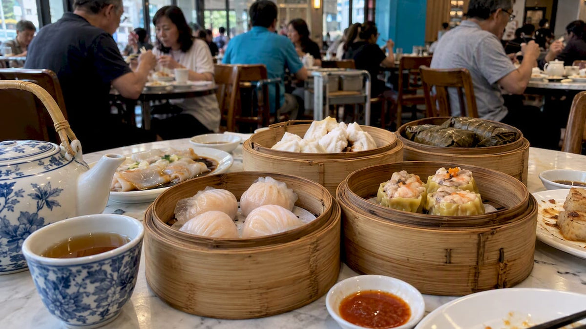 Dim sum steamers and tea on table